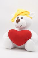 Мягкая игрушка Медвежонок Ромул, старший, 37/43 см, в желтом колпаке с кисточкой и средним красным сердцем, 0811137S-29-47